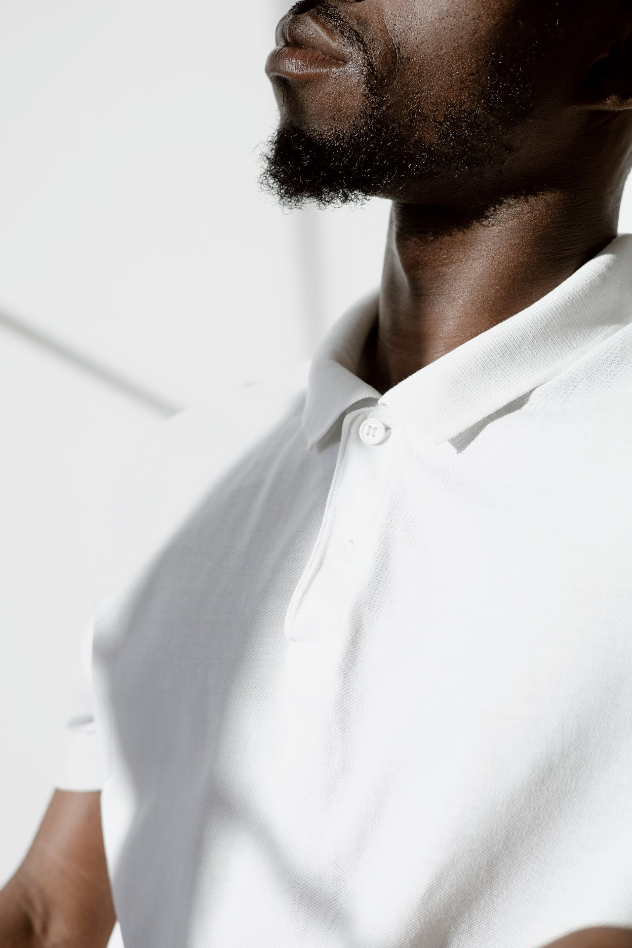 Close-up of a classic white piqué polo collar